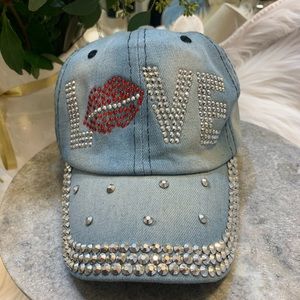 Brand new Love denim and rhinestone red lips bling hat. Adjustable